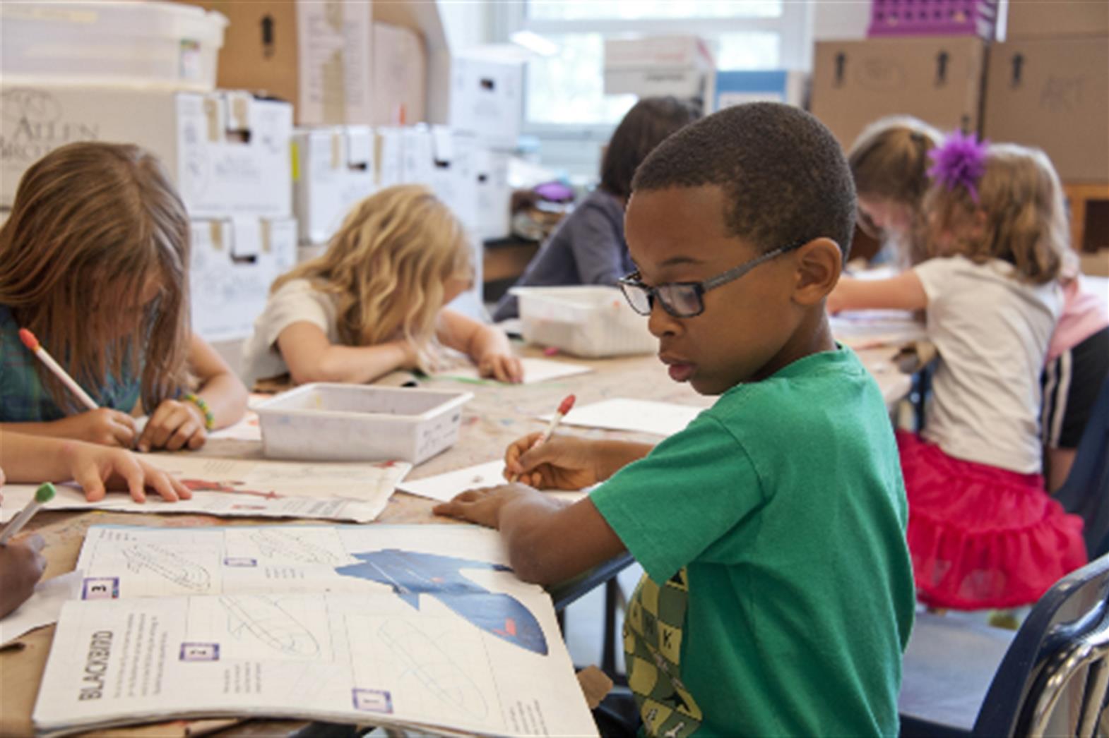 Young children working at their desks