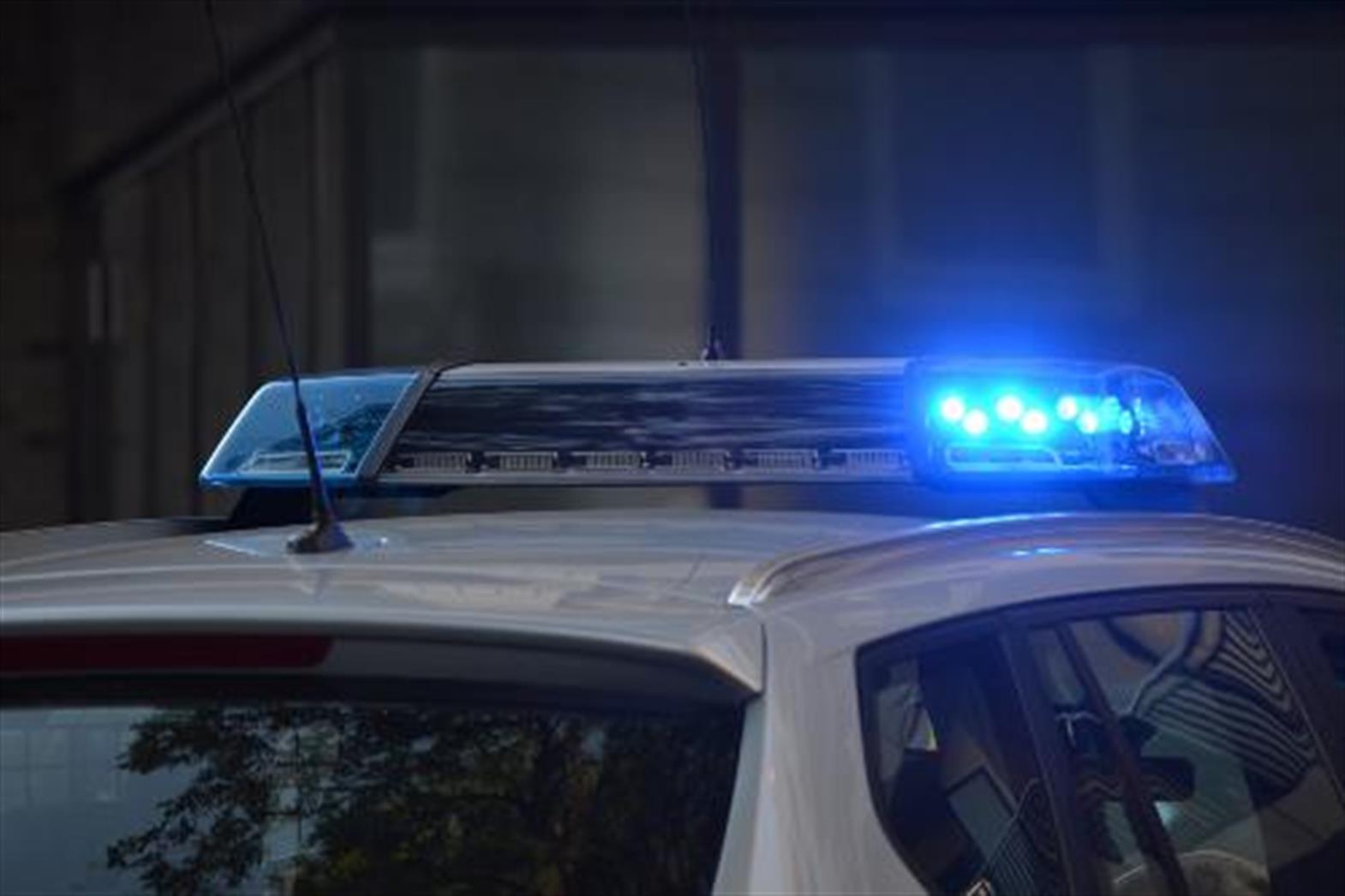 the roof of a police car with lit sirens