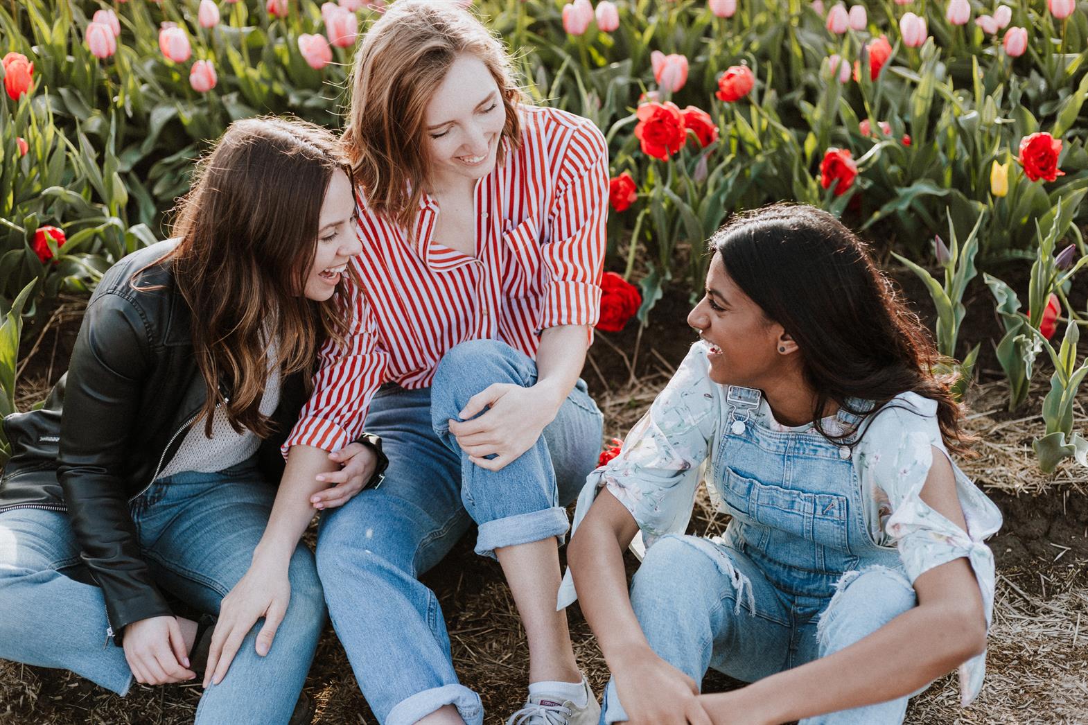 Three young women talking