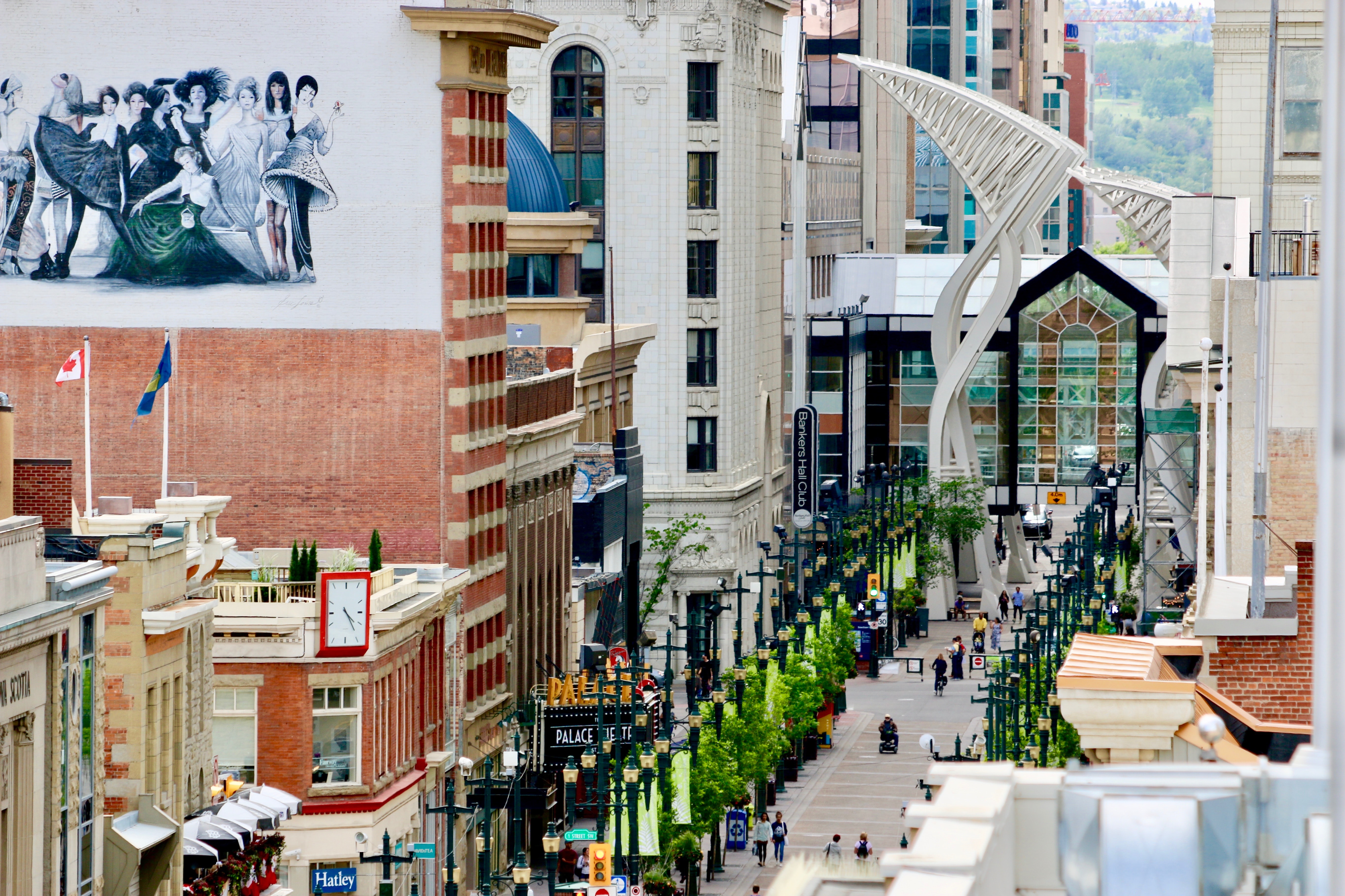 Boulevard in Calgary Alberta, tree lined street with shopping buildings on either side.