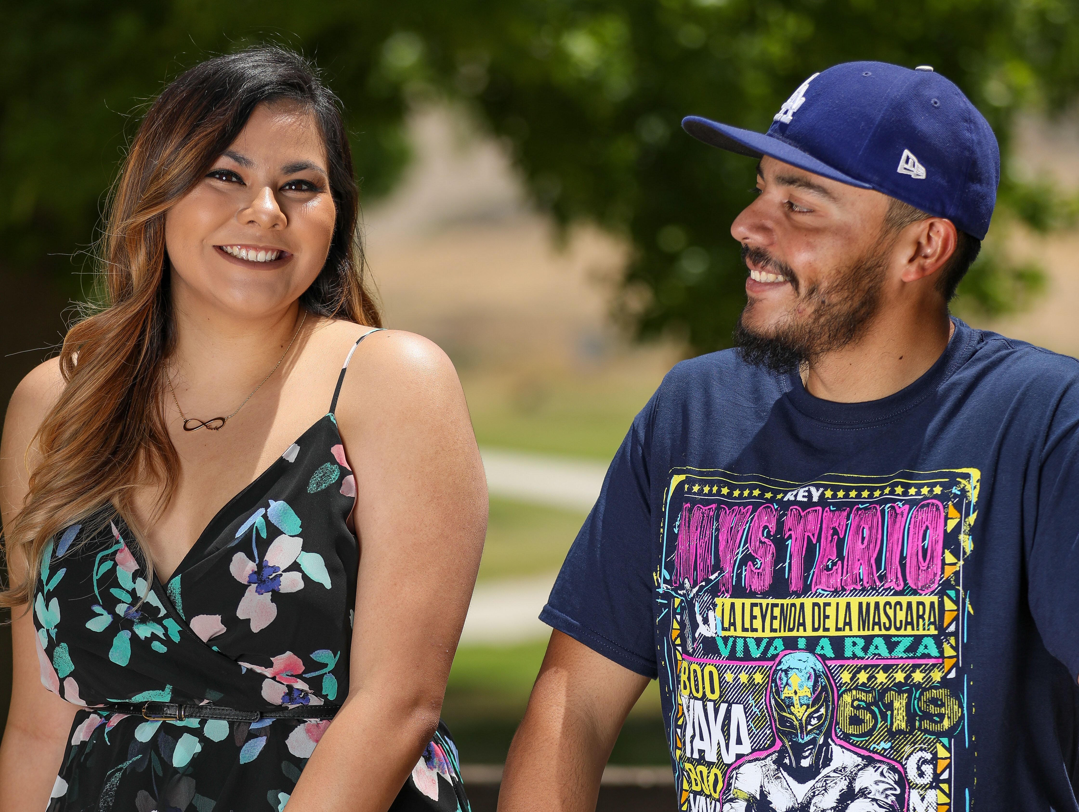 two adult siblings smiling