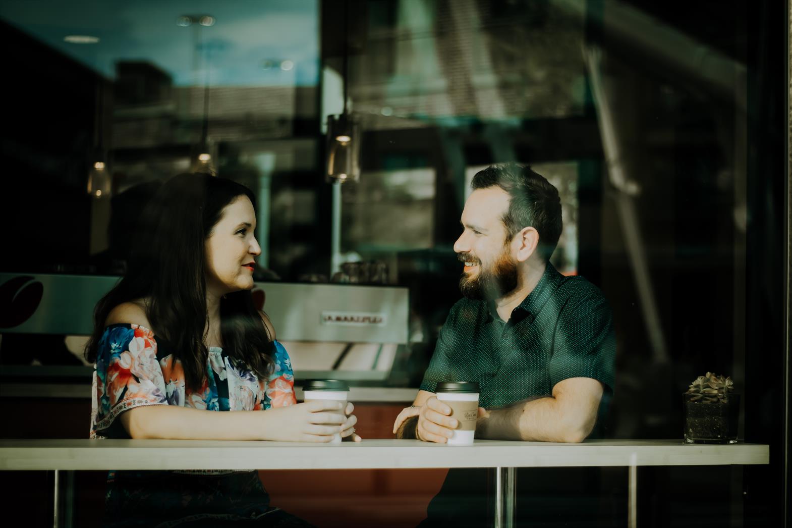 Couple talking in a cafe