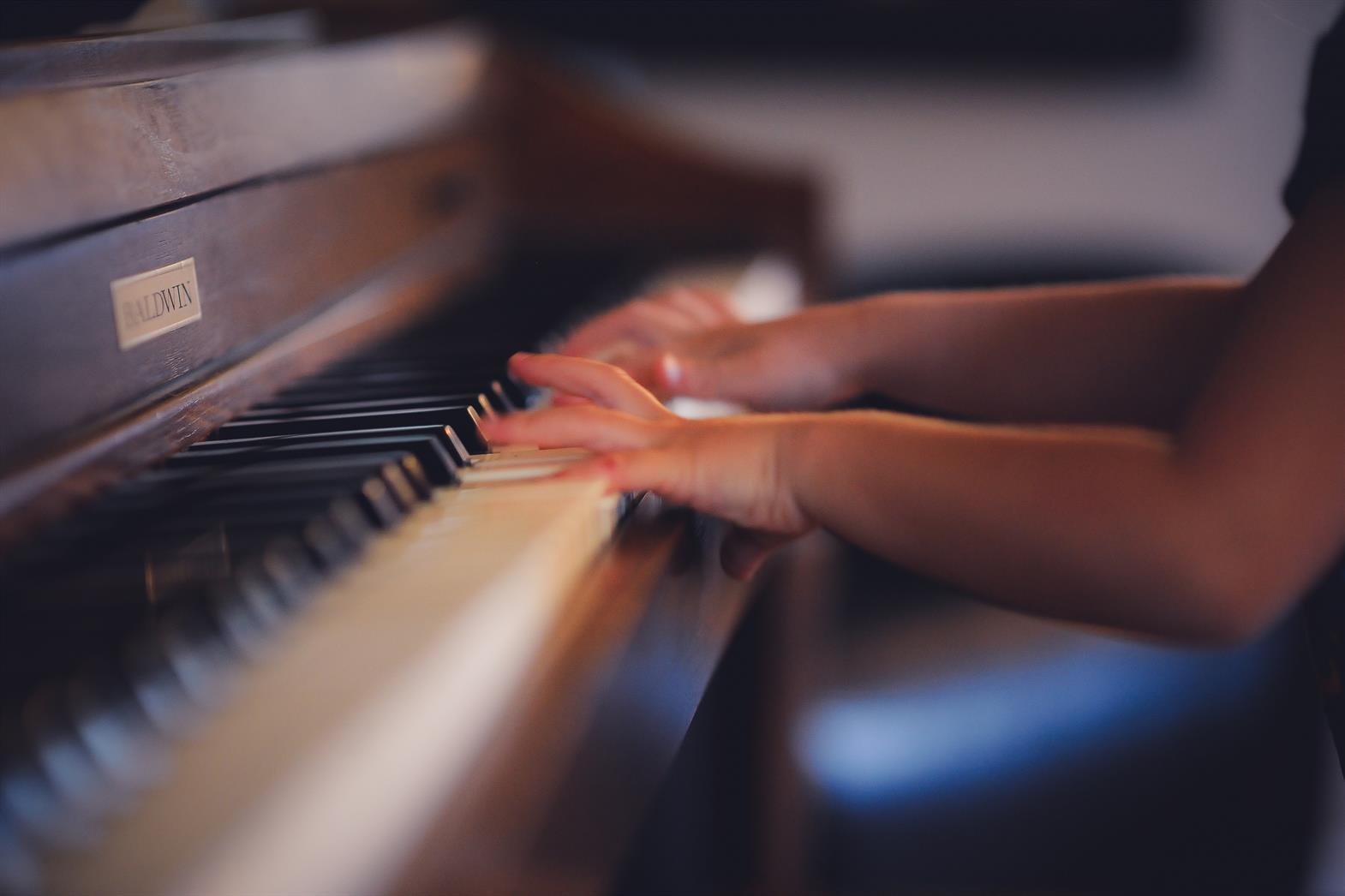 youth playing piano