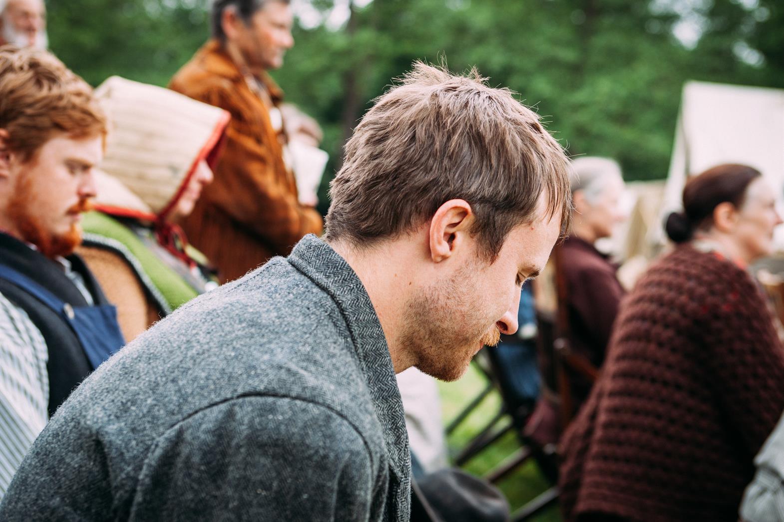 Adult man looking down