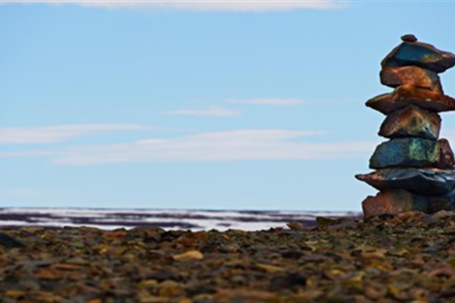 Inukshuk by a body of water