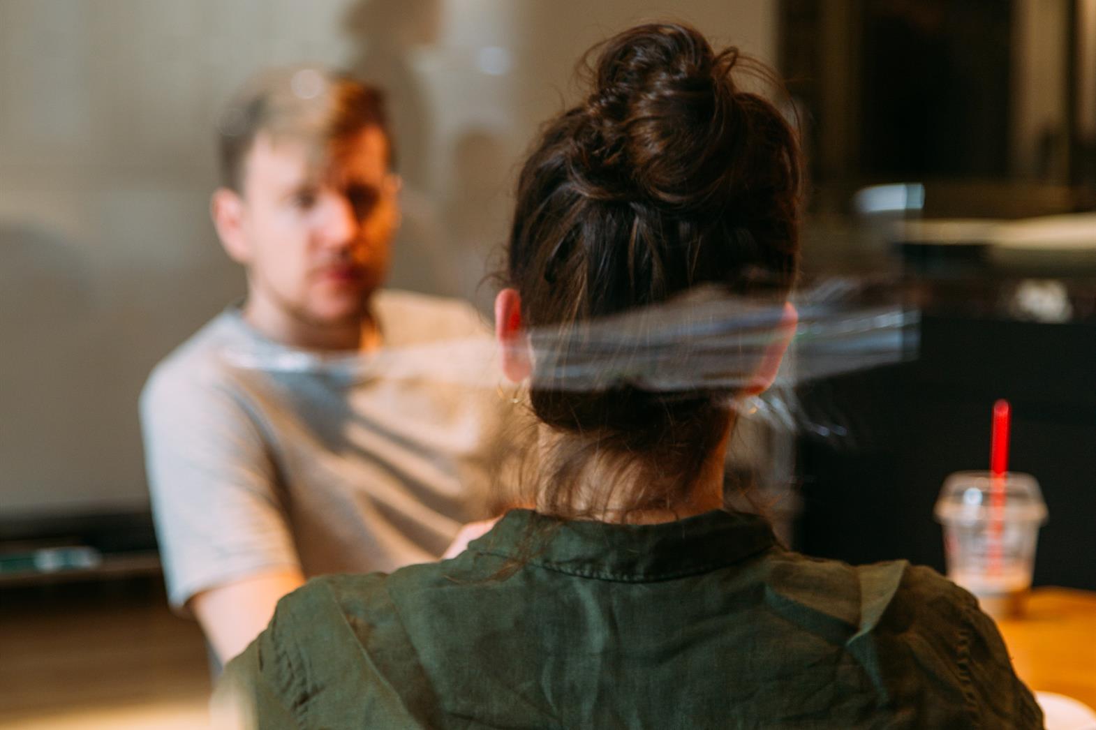 Person sitting in a chair in front of another person